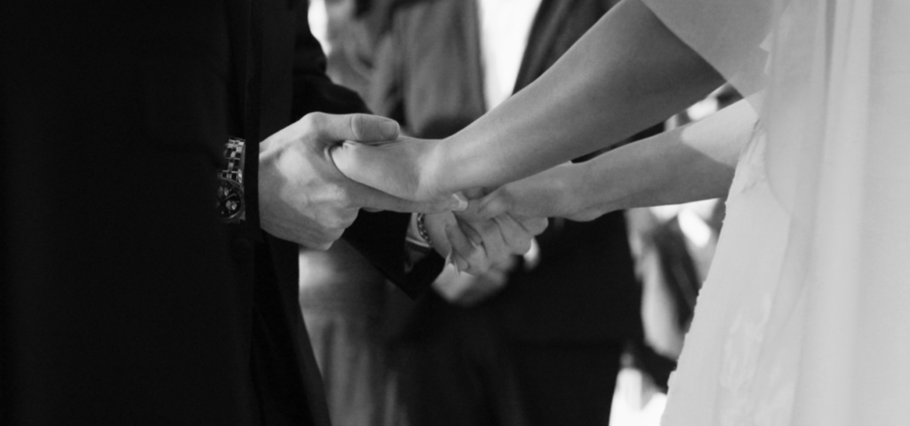 Two people holding hands.